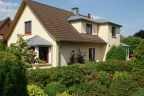 Südansicht mit Wärmedämmverbundsystem und Wintergarten